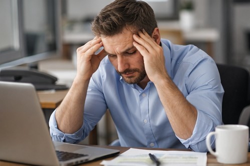 person distracted using phone while working multitasking